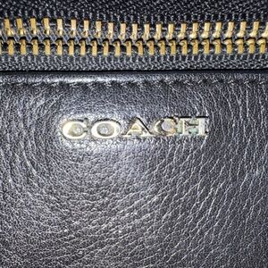 GUC: Coach Black Leather Wristlet with black and white sides!